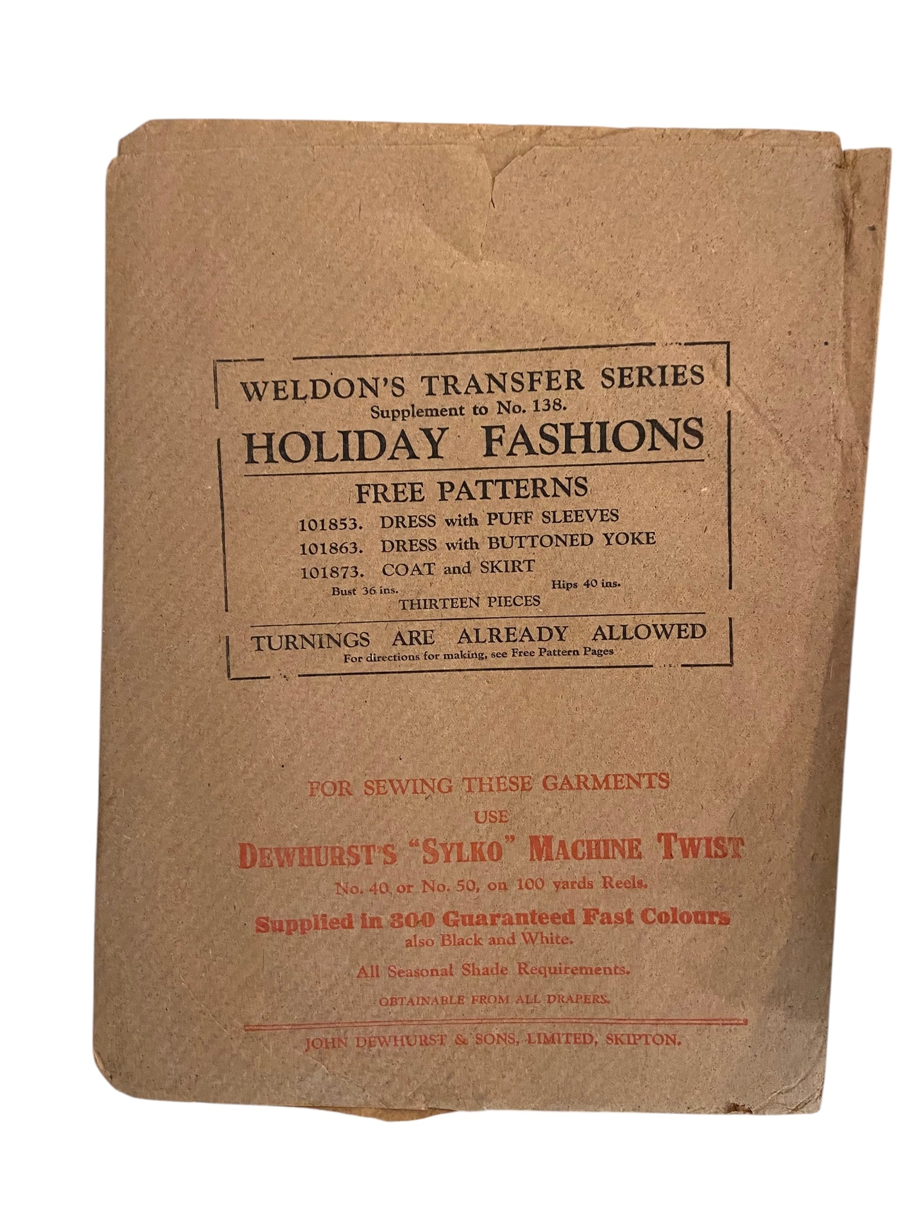 Weldon’s Holiday Fashions catalogue No. 138 circa 1930s with three sewing patterns, unused, factory folded dress with puff sleeves, dress with buttoned yoke, coat and skirt. Bust 36 inches. Transfers included.